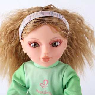 Close-up of Anna doll's face, showing her expressive features and detailed blonde curly hair.