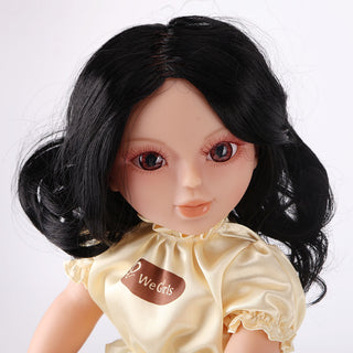 Close-up of Wanru doll's face, showcasing her sweet expression and detailed black curly hair with hairband.
