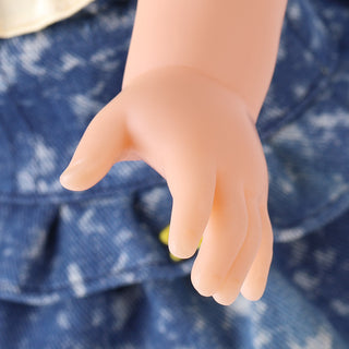 Close-up of Wanru doll's articulated hand, capable of posing to hold baking tools like a whisk or rolling pin.