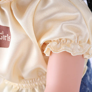 Extreme close-up of the puff sleeve on Wanru doll's top, showing the gathered fabric detail and sewing craftsmanship.