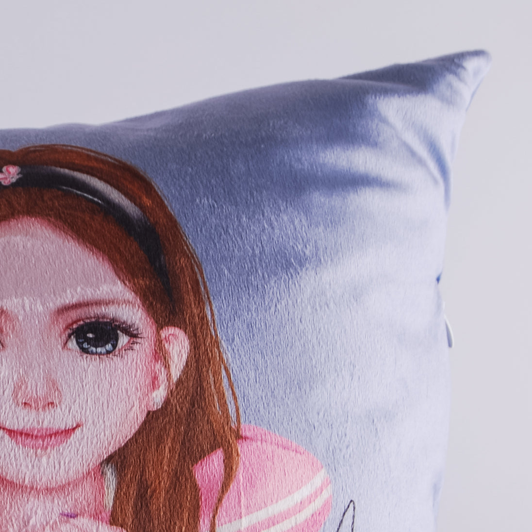 Close-up showing the ultra soft plush material of the WeGirls pillo