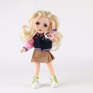 WeGirls Lucy doll in baseball jacket and brown pleated skirt - full front view