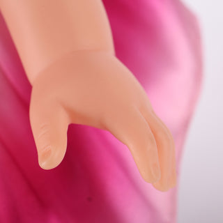 Close-up of Natasha doll's posable plastic hands, shaped for delicate ballet gestures