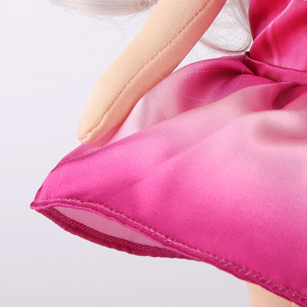 Detailed close-up of the flowing hem on Natasha doll's purple princess dress