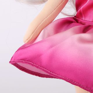Detailed close-up of the flowing hem on Natasha doll's purple princess dress