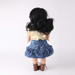 Back view of Wanru doll highlighting her detailed black curly hair and the back design of her baking outfit.