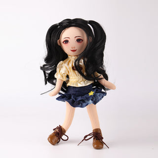 Front view of Wanru doll with black curly hair in yellow puff sleeve tee and denim cake skirt