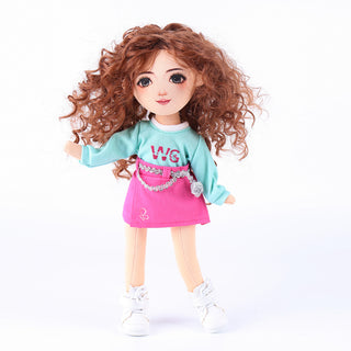 Front view of Yufei doll with brown wavy hair in cute pose wearing mint tee and pink skirt